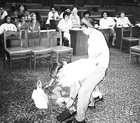 School children practice a skit of a youth who attacks and robs a woman because "I’m hungry."