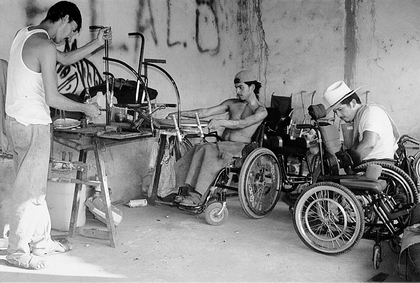Elijio, Alejandro, and Gabriel build children's wheelchairs. Elijio, who is epileptic, but otherwise physically fit, helps with some of the heavy lifting and moving of things that is more difficult for his paraplegic co-workers. (For more about Alejandro, see page 4.)