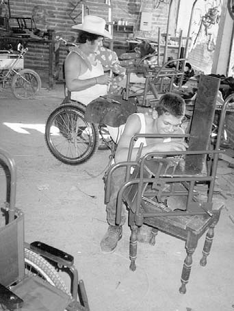 Gabriel Zepeda (left) and Chente Bañuelos construct children’s wheelchairs in in their new shop location in the village of Ajoya, Sinaloa, Mexico.