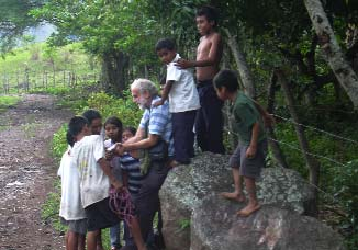 Children with David Werner on steep dirt road to Yelvin’s family’s hut.