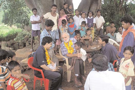 A meeting under a tree with local Vikash CBR workers, disabled children, and their families in a tribal village of Koraput, Orissa.