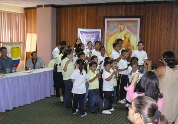 Mentally handicapped children from Instituto Juana sing at the Central American Seminar on CBR.