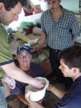 Recently Marcelo (top right) left PROJIMO and joined Mas Válidos, an urban CBR program that grew out of PROJIMO. Before he left he trained Alberto in limb-making. Here Jon Batzdorff and Garret Hurley—volunteer prosthetists from California—help Alberto (center) upgrade his skills.