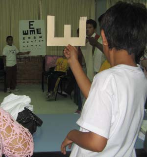 Hand-made eye charts work well and encourage creativity.