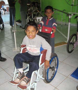 His custom designed chair makes moving about much easier. The chair also provides stability for his younger brother, whose body is also growing weaker because of muscular dystrophy.