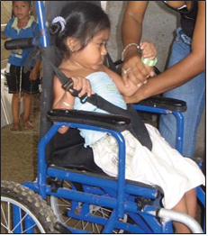 María’s wheelchair was much to big for her. The straps, which go over her shoulders and pass between her legs, do not prevent her body from arching up and slipping forward.