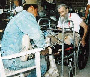 Marcelo always did the best he could to assist others in achieving their goals. Here he fits a prosthetic foot for my brother.