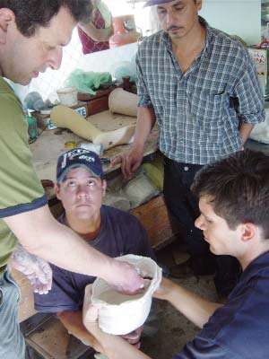 Marcelo—together with visiting prosthetists Jon Batzdorff and Garrett Hurley—train Alberto, himself a young amputee, to make prosthetic limbs. He started with a leg for himself.