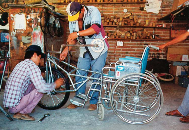Marcelo was exceptionally creative. Here he develops and builds a removable hand-powered tricycle attachment to a wheelchair for traversing rough terrain more quickly and easily.