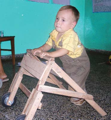 Alejandro tries his new walker. Both he and his mother were delighted!