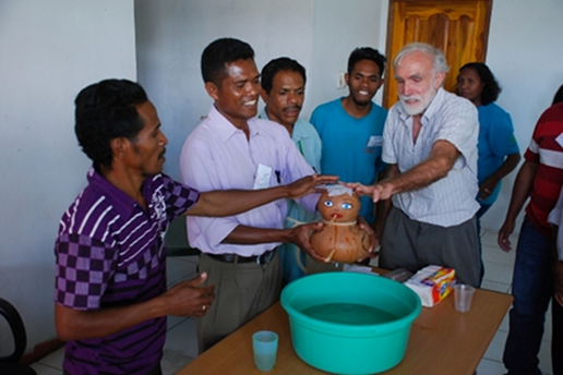 Here the SHARE team uses the "gourd baby" to help learners discover the danger signs of dehydration that can result with diarrhea.