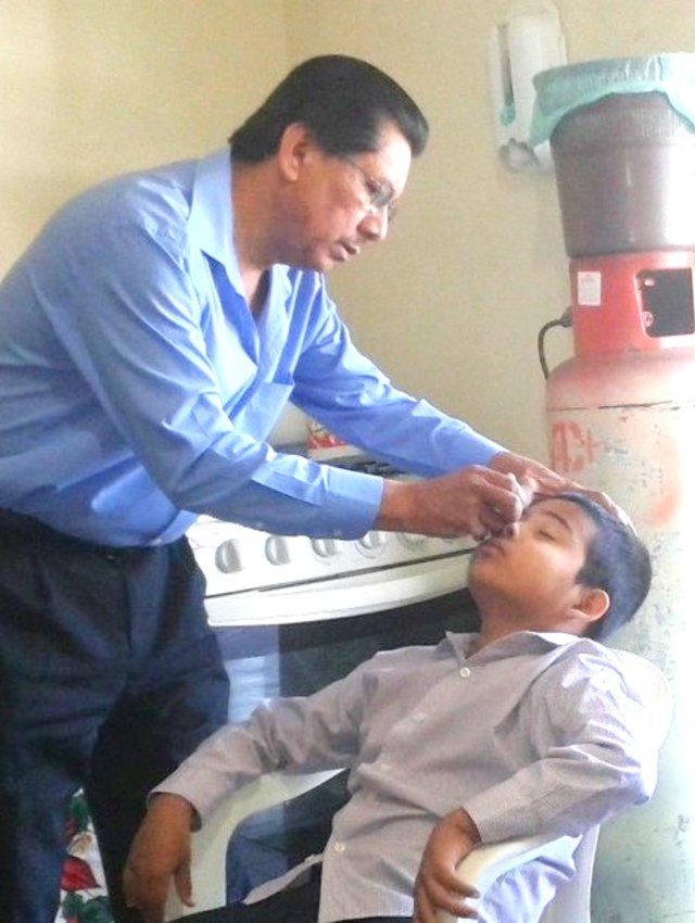 Dr. Alvarez examining Ramon