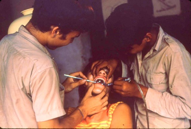 Miguel Angel Manjarrez (left, age 14) teaches Miguel Angel Alvarez (age 13) how to drill and fill teeth.